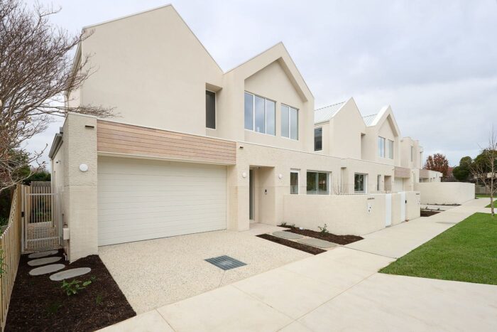 Contemporary Murrumbeena townhouse with pitched roofline and cream brick facade