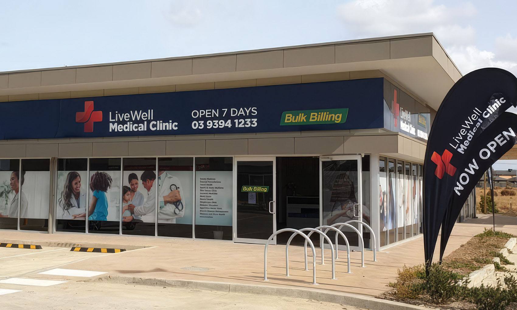 Completed low-rise medical clinic exterior with signage and public entry